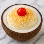 Coconut Ice Cream In Shell 5 Smooth coconut ice cream in shell served inside a real coconut shell with coconut flakes