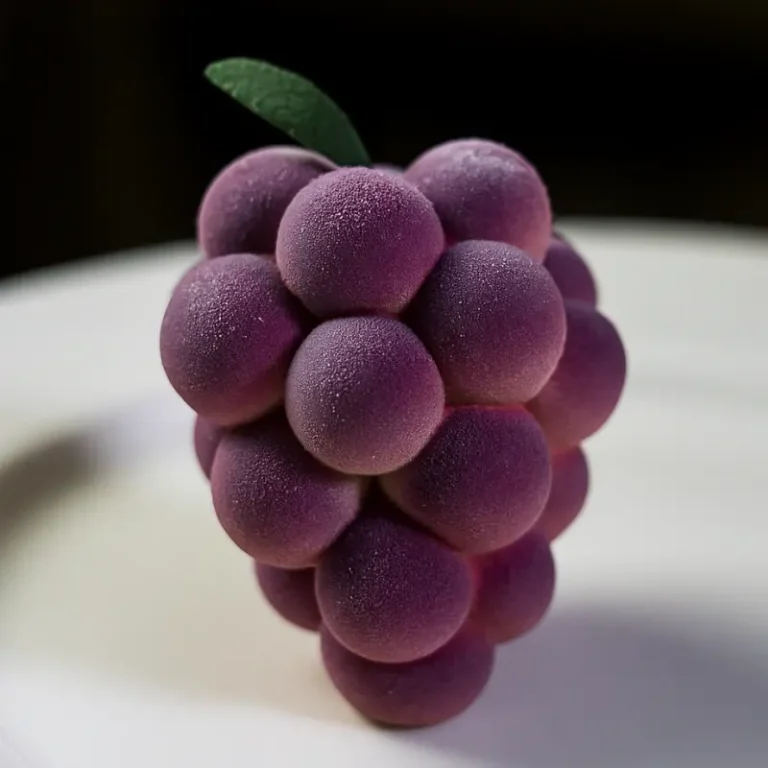 Grape Shaped Pastry 1 Realistic grape shaped pastry on a white plate