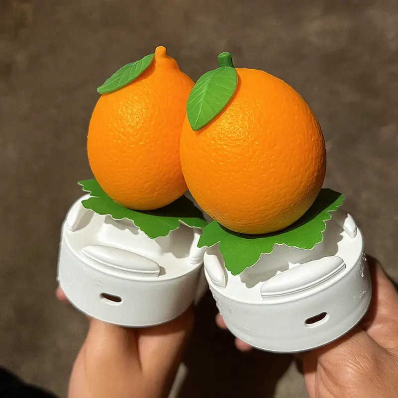 How To Make Orange Shaped Ice Cream 10 Two orange shaped ice creams in waffle cones with green leaf toppers