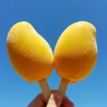 Mango Shaped Ice Cream: 5 Viral Flavor Desserts 8 trendy mango shaped ice cream held outdoors