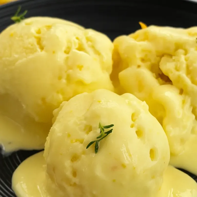 Meyer Lemon Ice Cream Magic: Rich, Lush & Dairy-Free 9 Dairy-free meyer lemon sorbet in a bowl with orange slices