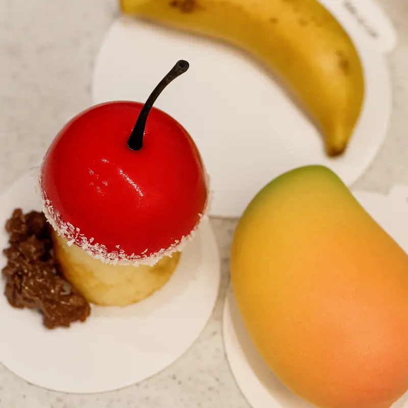 Unbelievably Fun Fruit Shaped Mousse Cakes To Try Now 20 Glossy Dessert Shaped Like Fruit green apple dessert with chocolate stem and mousse filling
