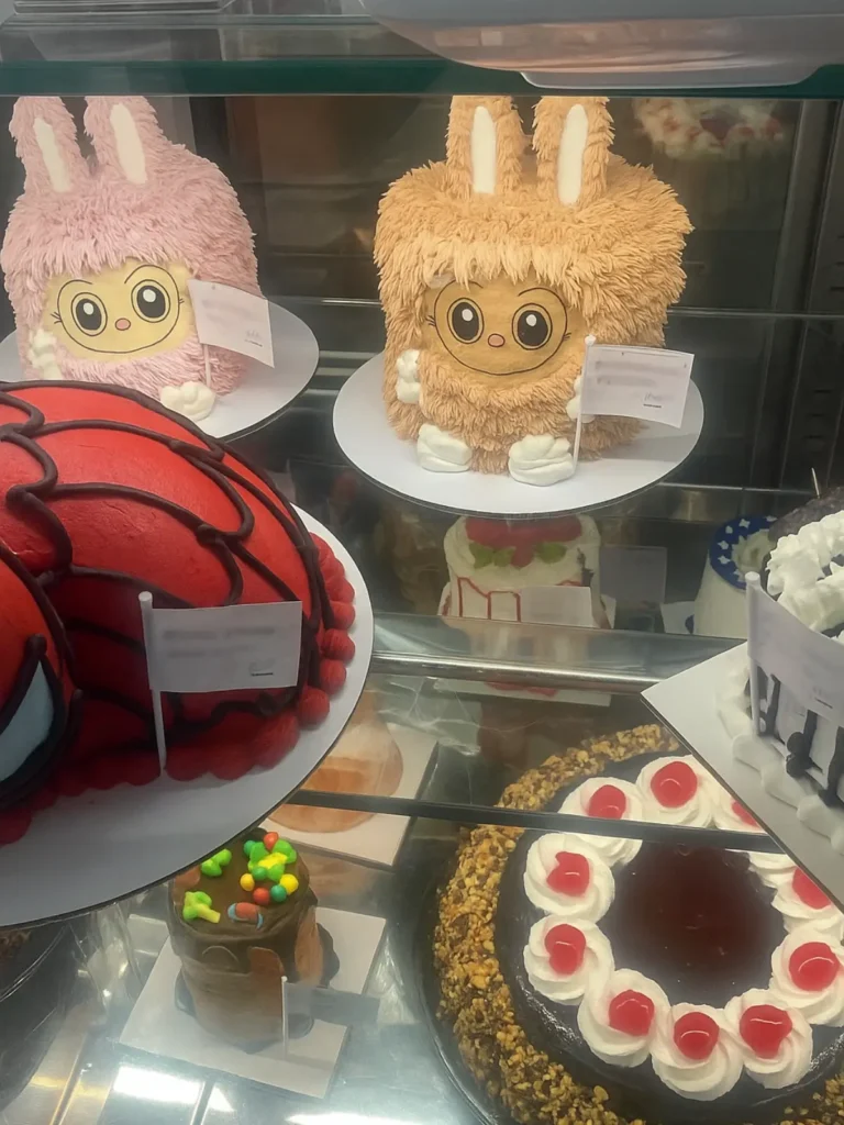 Green Labubu cake from Baskin Robbins with fuzzy frosting texture