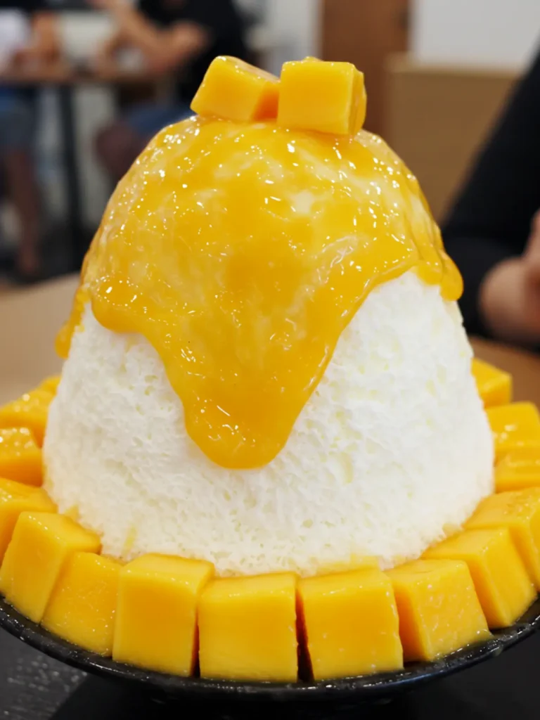 frozen dessert Asia with mango cubes and sweet condensed cream