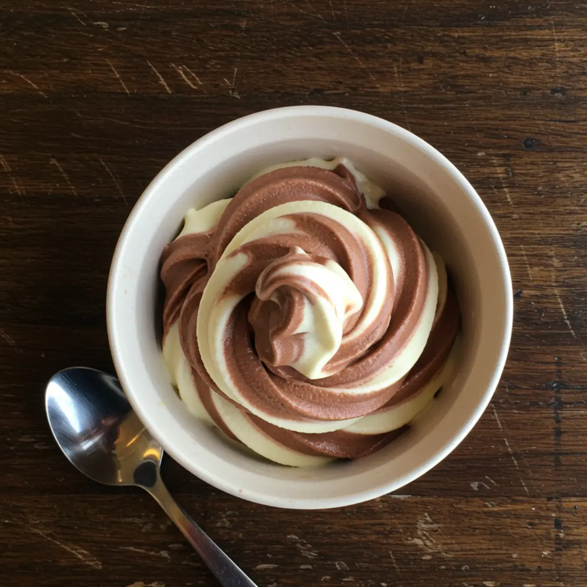 Easy High Protein Ninja Creami 3 A bowl of homemade chocolate and vanilla soft serve from one of our Ninja Creami swirl recipes.