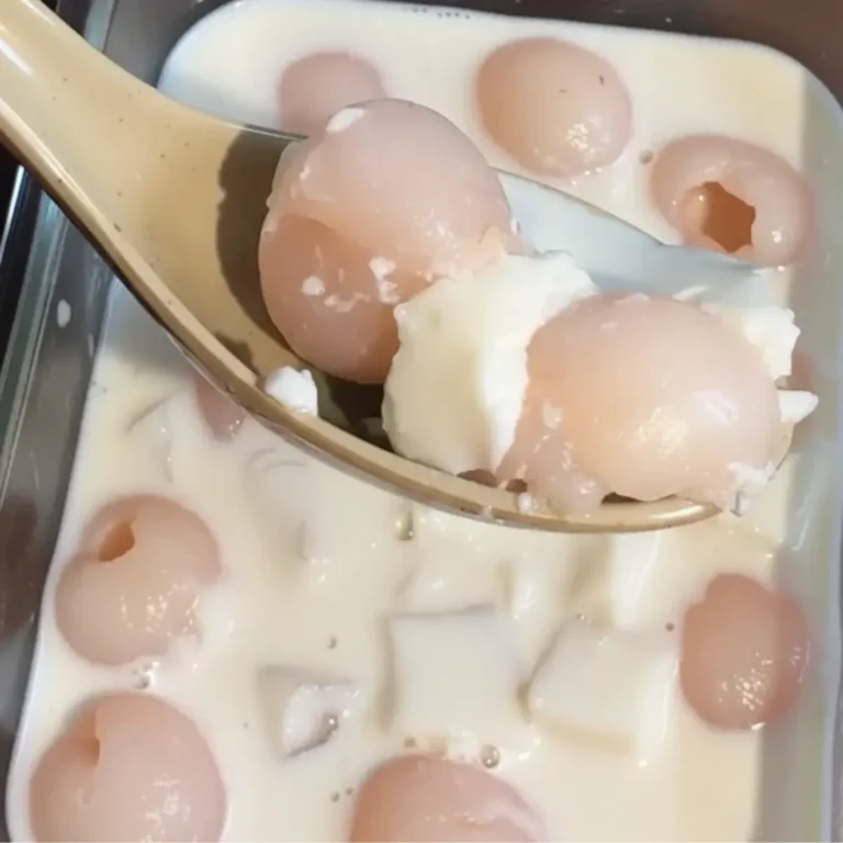 Viral Lychee Panna Cotta: The Easy Recipe You Need 18 Two glasses filled with layers of viral lychee panna cotta and a fresh strawberry topping, ready to serve.
